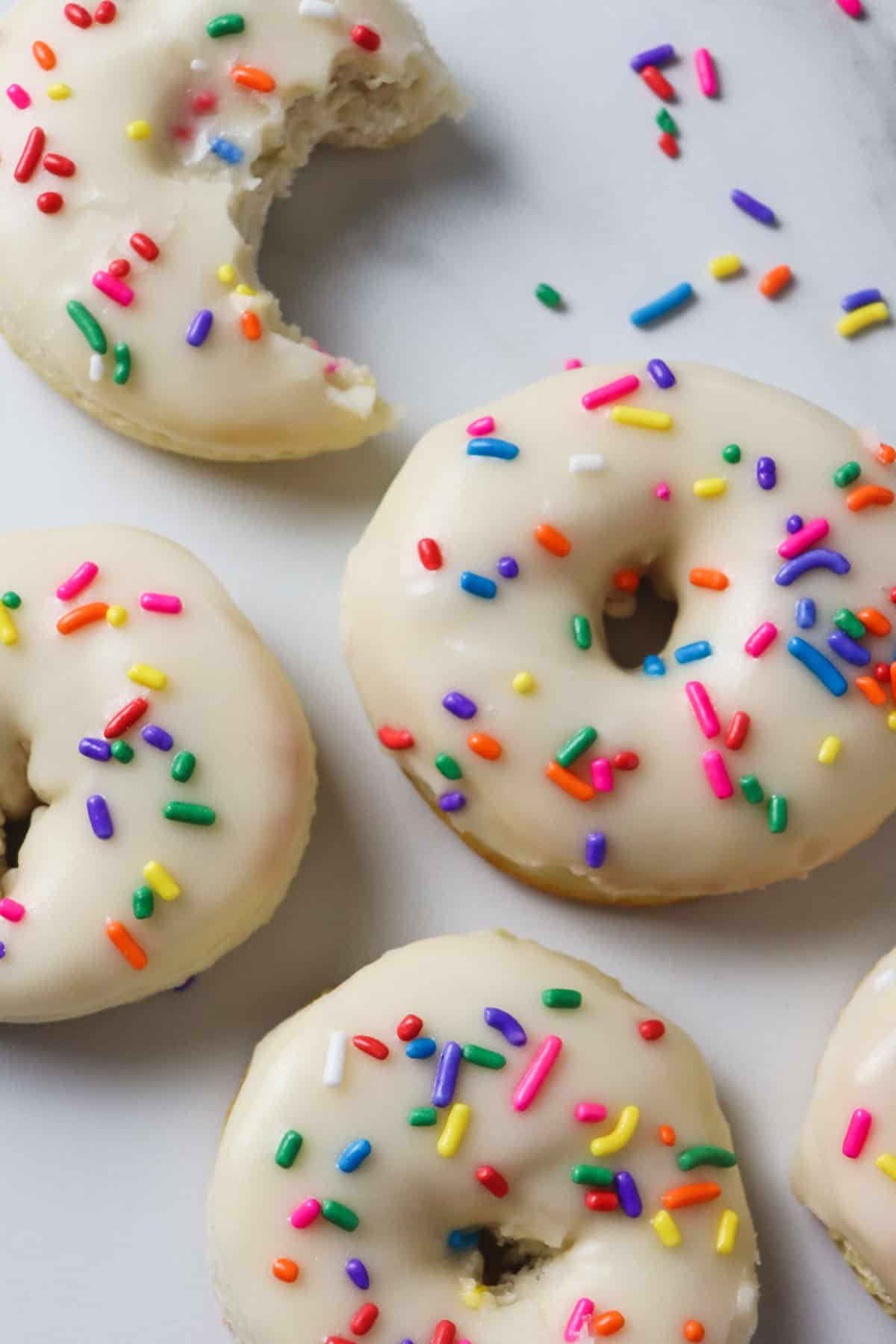 finished air fryer biscuit donuts with sprinkles