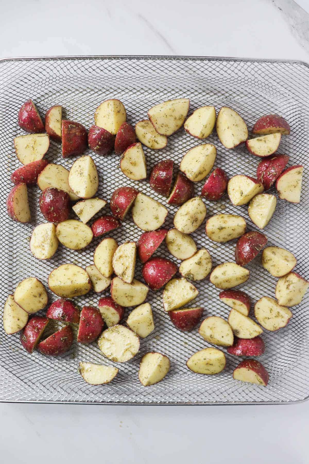 diced red potatoes in air fryer basket