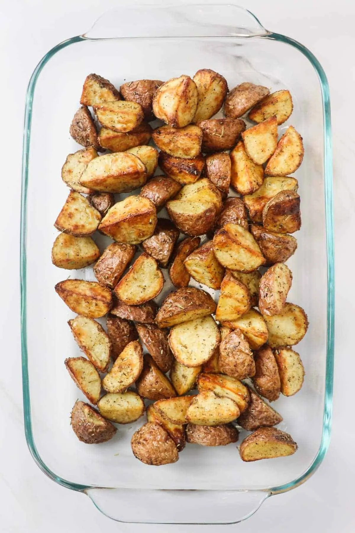 air fryer roasted potatoes in glass casserole dish