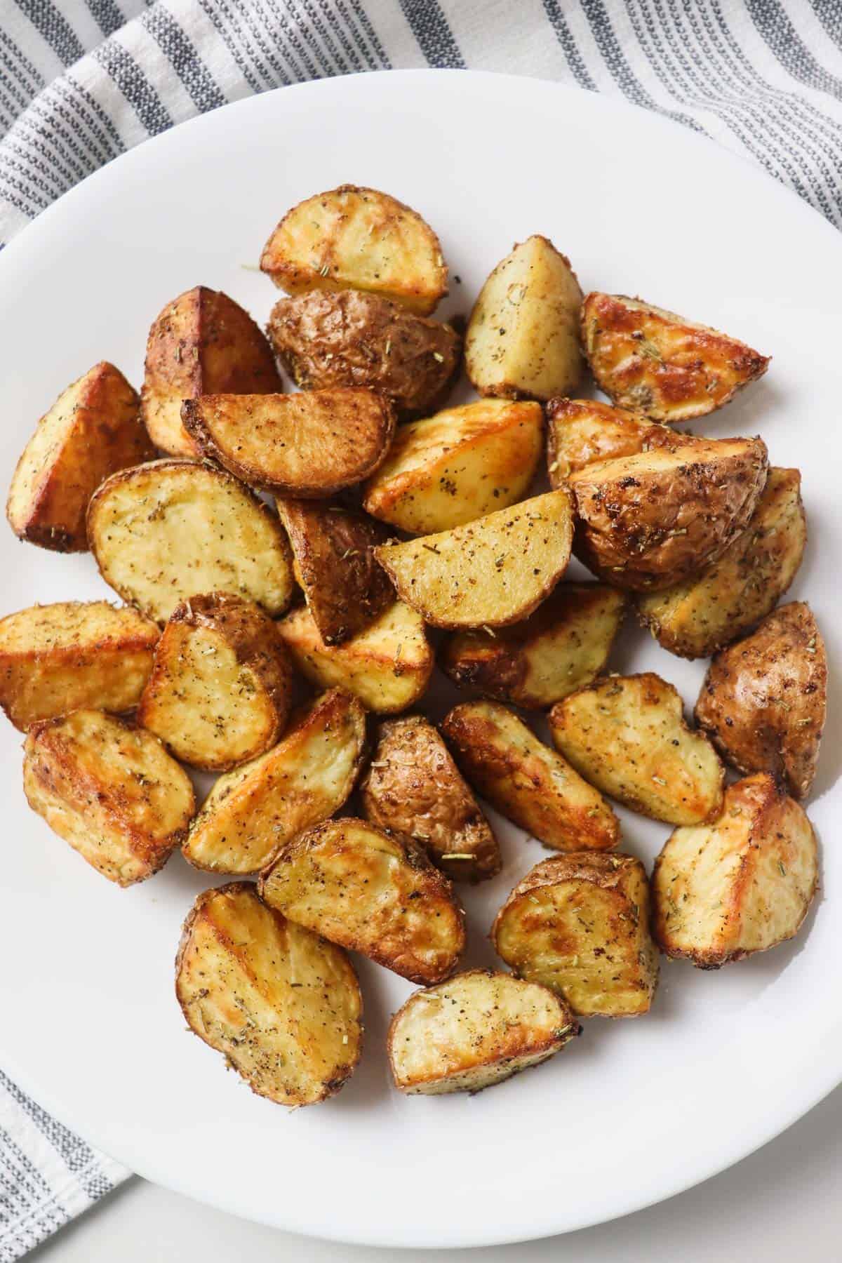 roasted potato pieces on white plate
