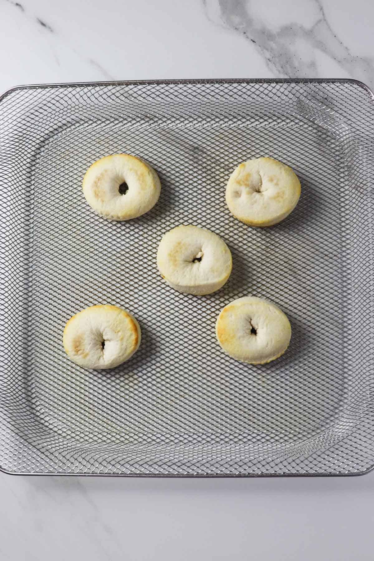 air fryer biscuit donuts in basket after baking