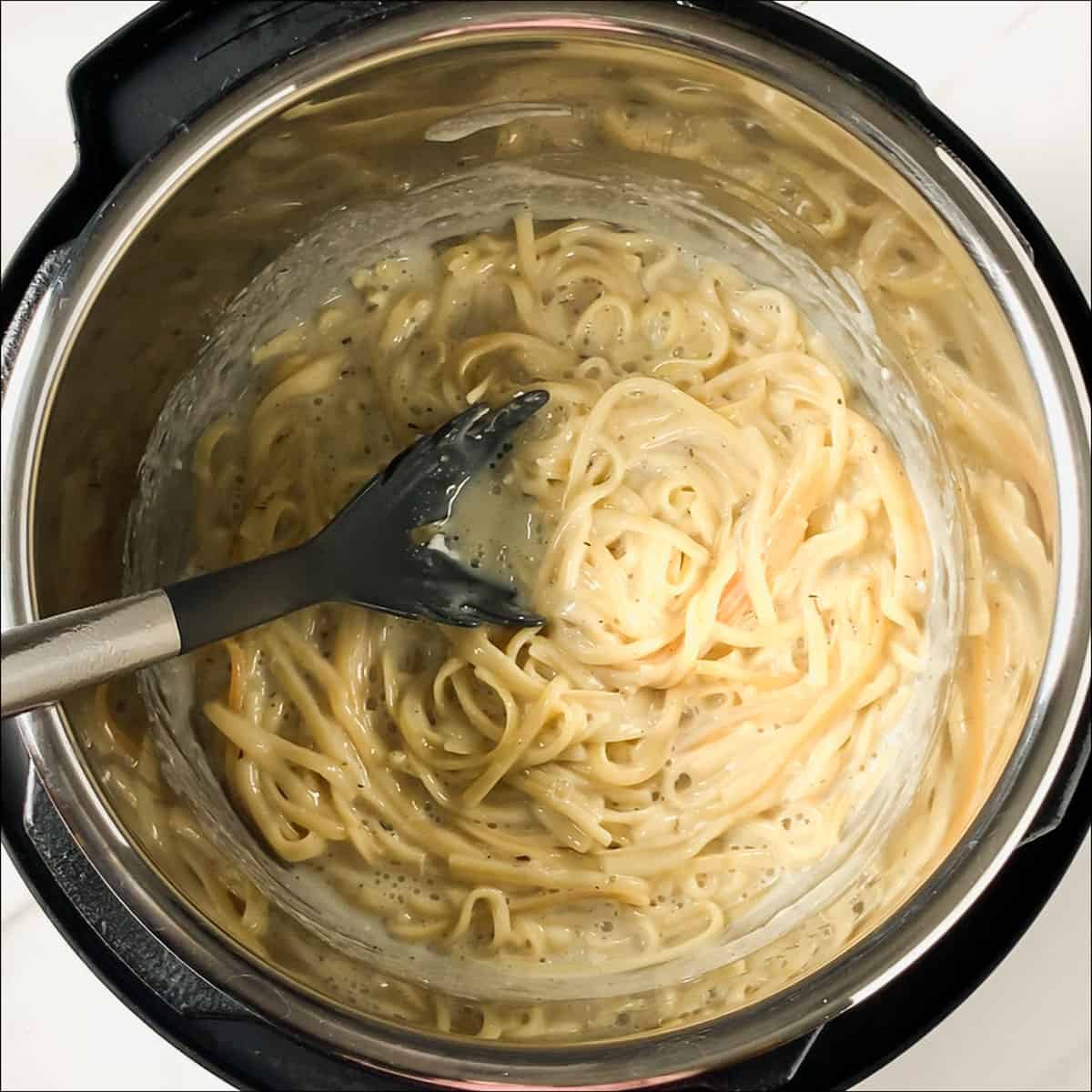 cream cheese mixed into alfredo sauce in instant pot