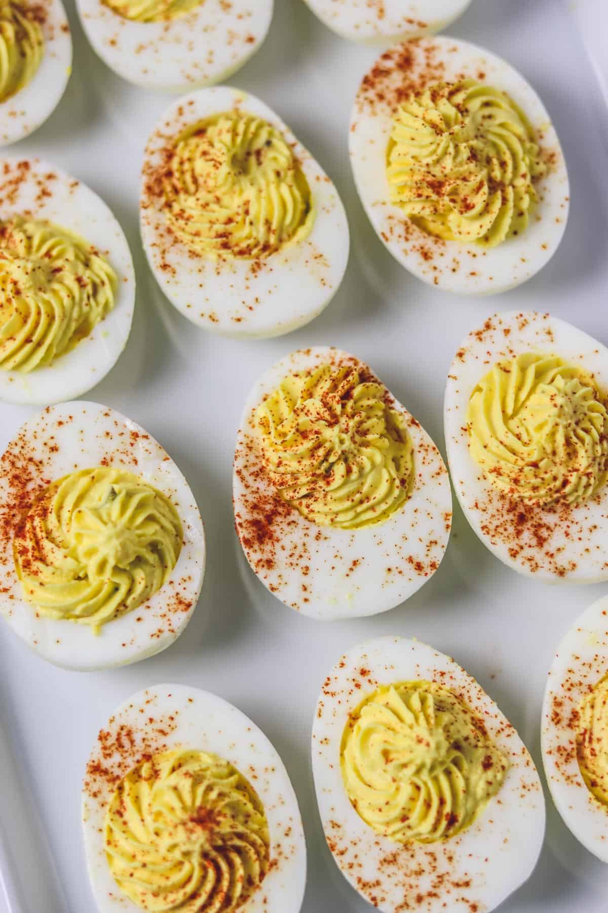 deviled eggs on white platter