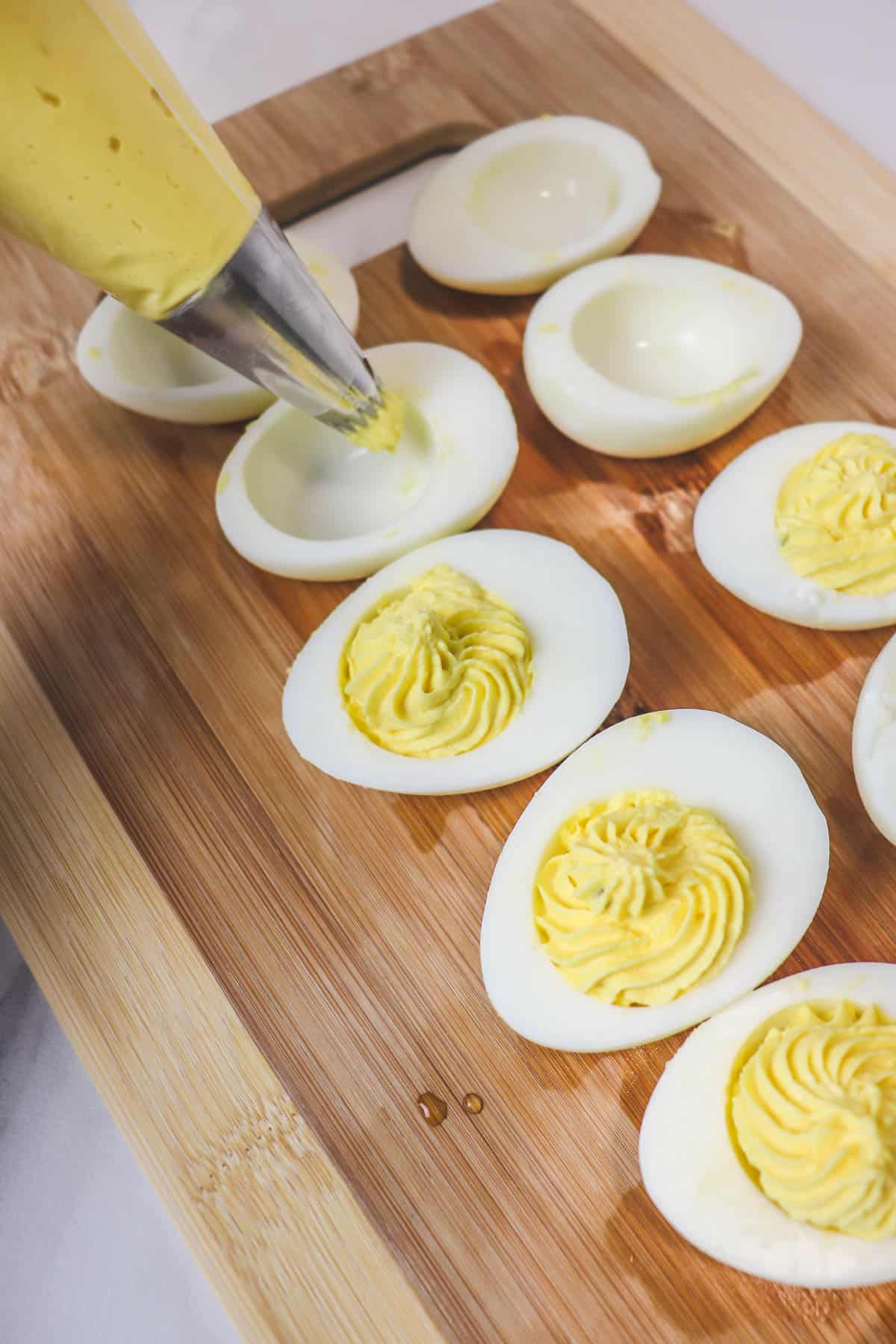 filing egg whites with deviled egg filling
