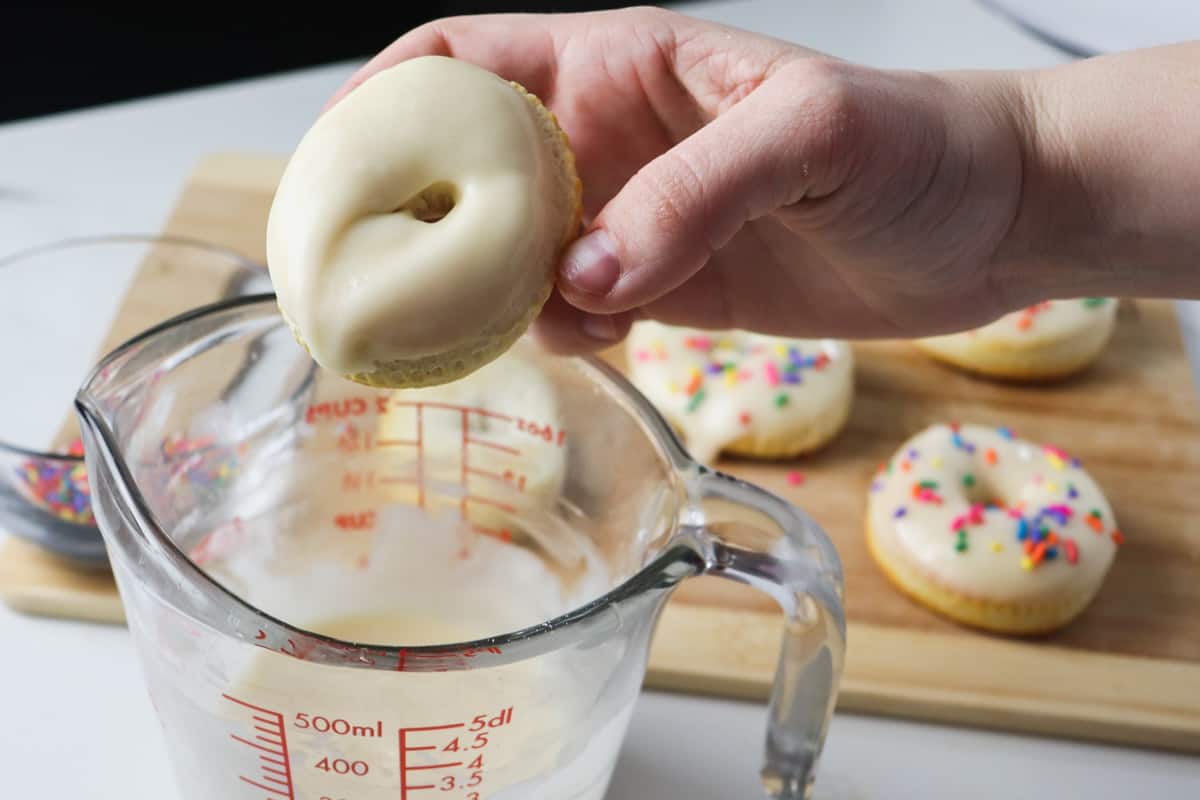 dipping air fryer donuts in glaze