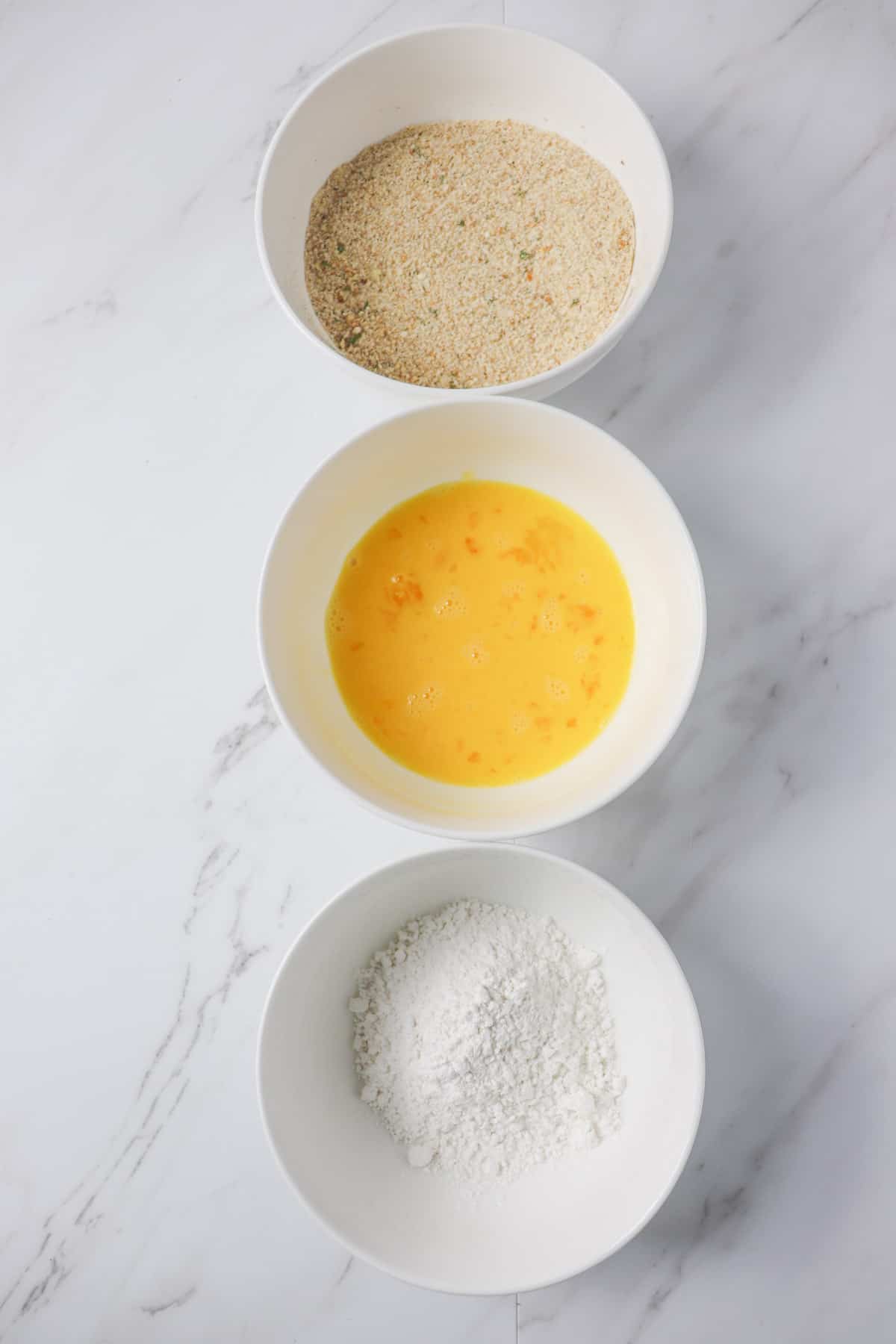 flour, egg, and breadcrumb mixture for chicken tender breading