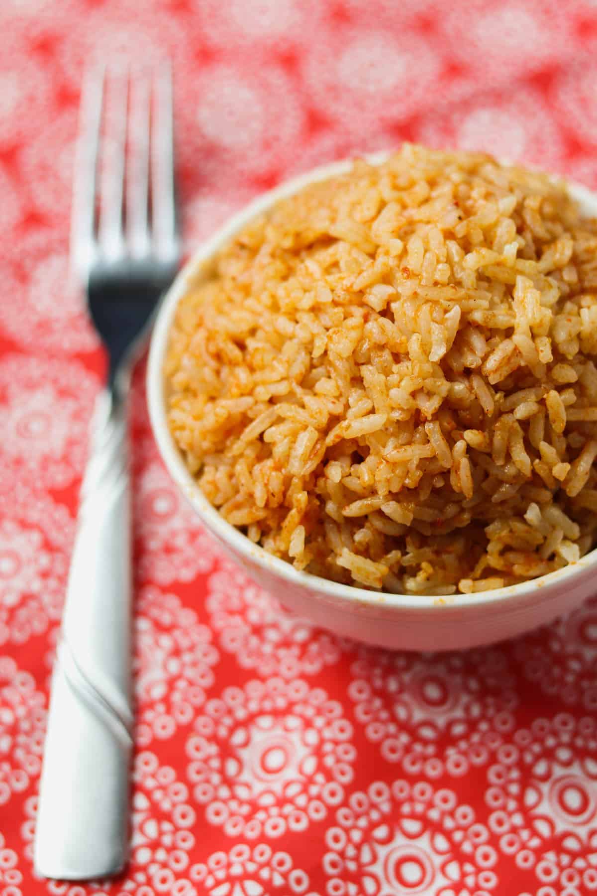 instant pot mexican rice in bowl with fork on red napkin