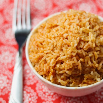 instant pot mexican rice in bowl with fork on red napkin
