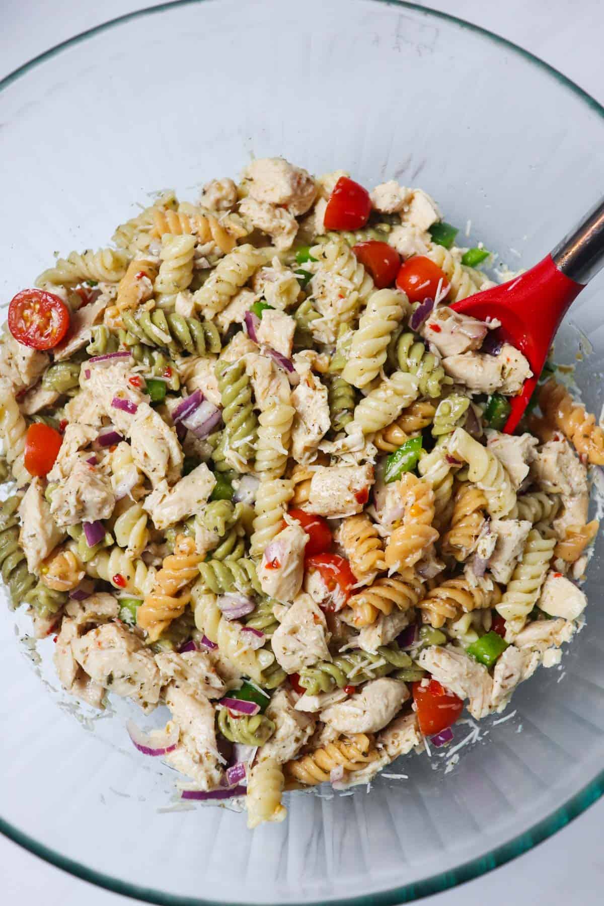 finished italian chicken pasta salad in large glass bowl