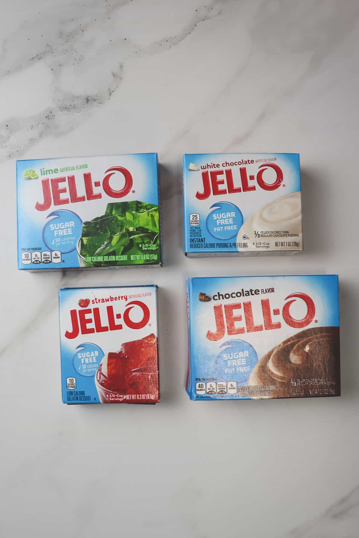 lime, white chocolate, strawberry, and chocolate jello boxes