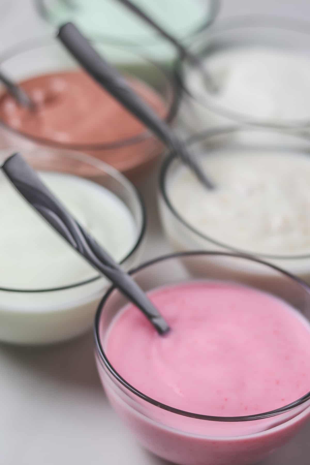 small glass bowls of flavored yogurt