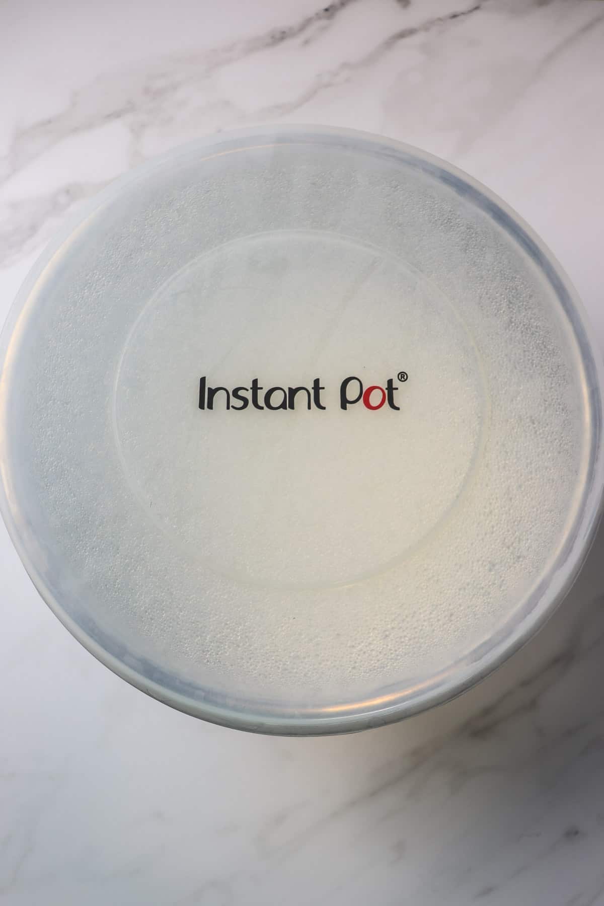 putting the lid on the instant pot liner