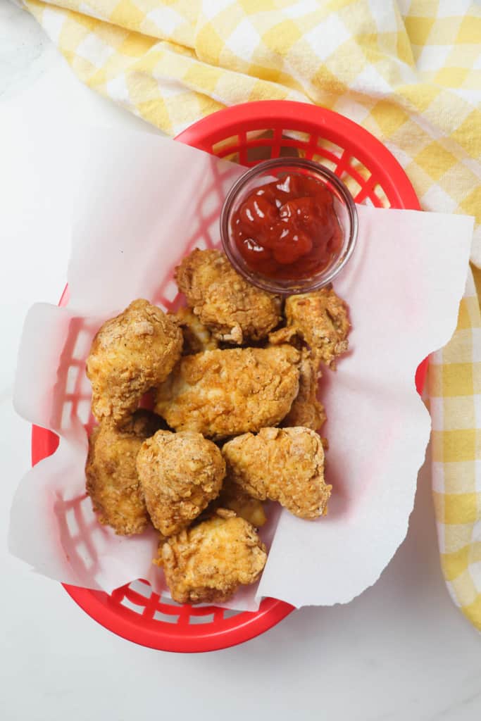 air fried chicken nuggets in red basket