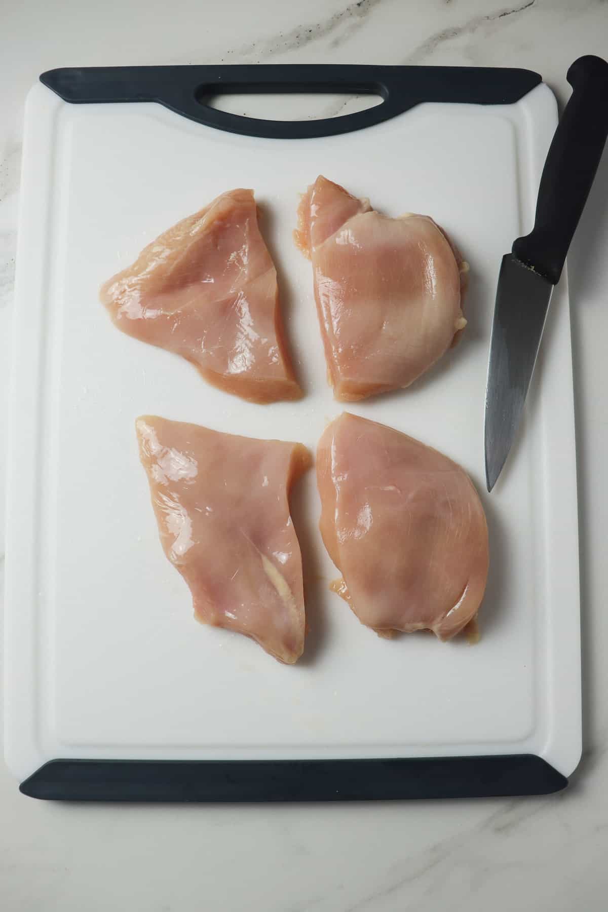 cutting chicken breasts into two pieces