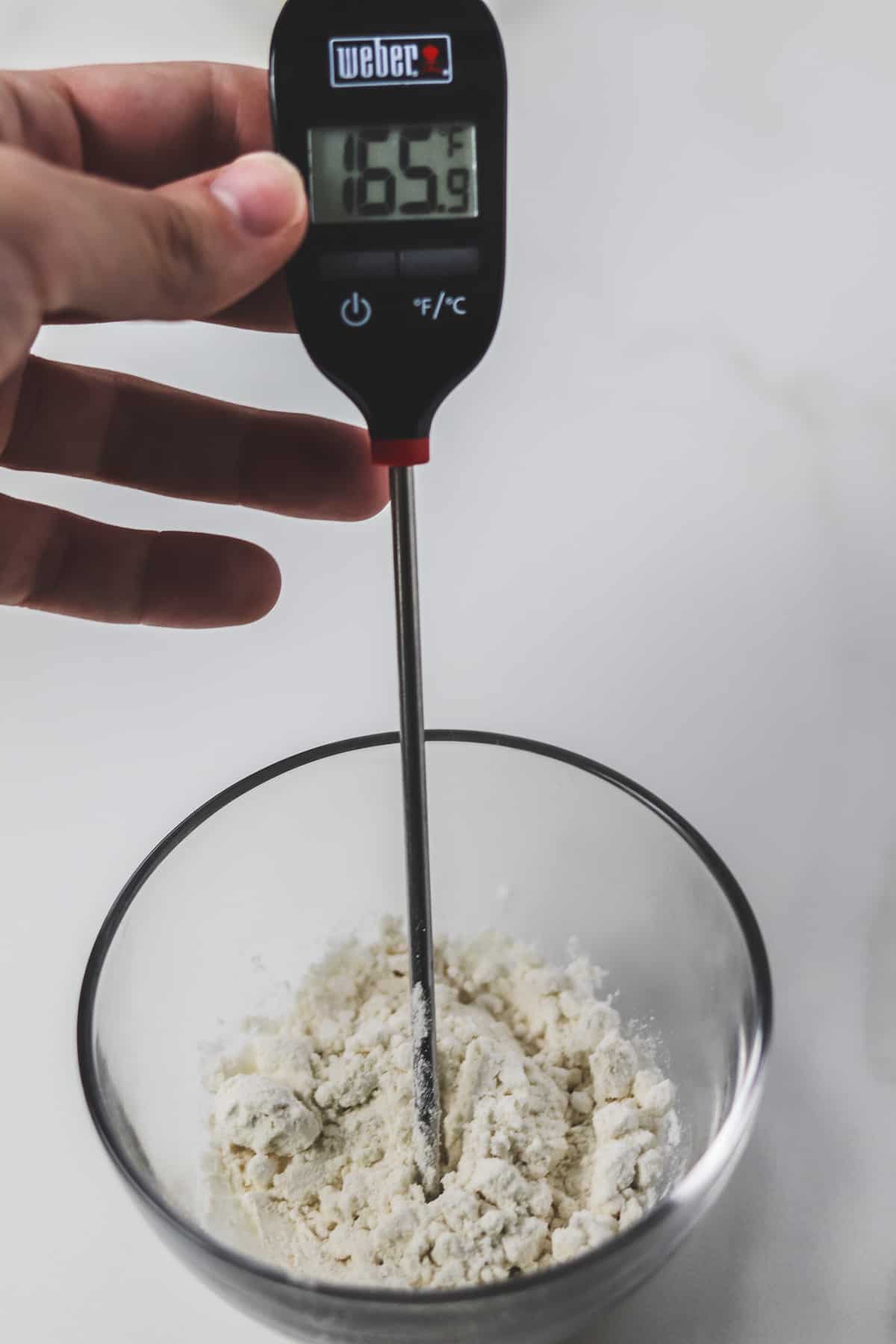 measuring the temperature of flour using a meat thermometer
