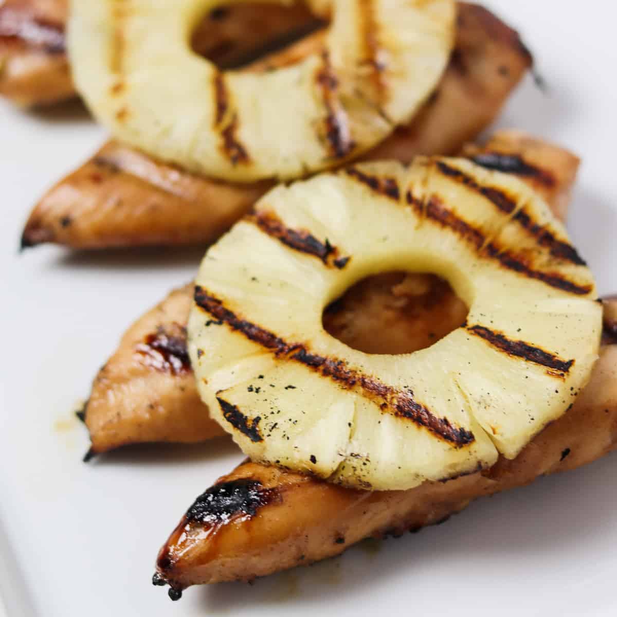 grilled chicken tenders with pineapple on top