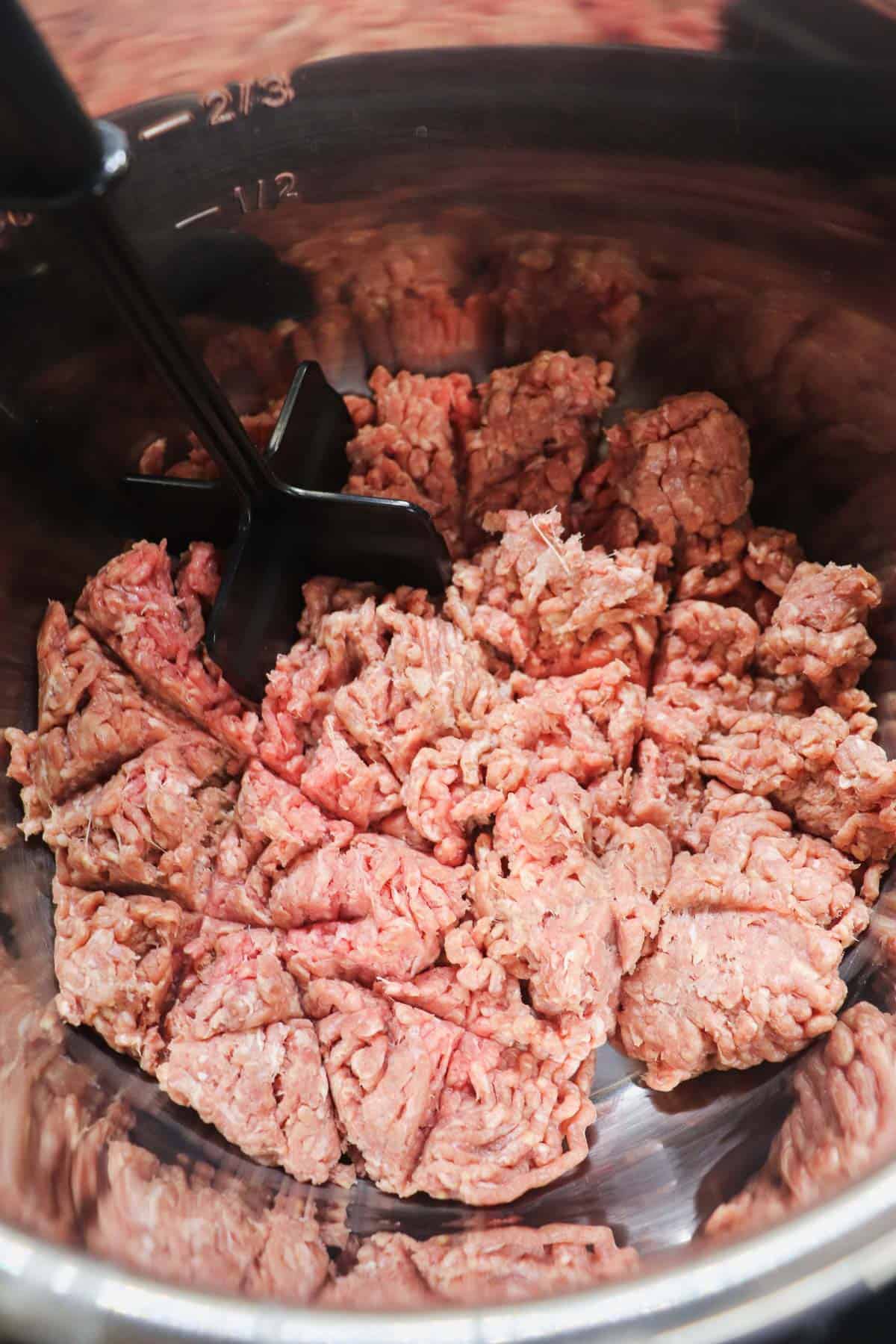 starting to cook raw ground beef in the instant pot liner