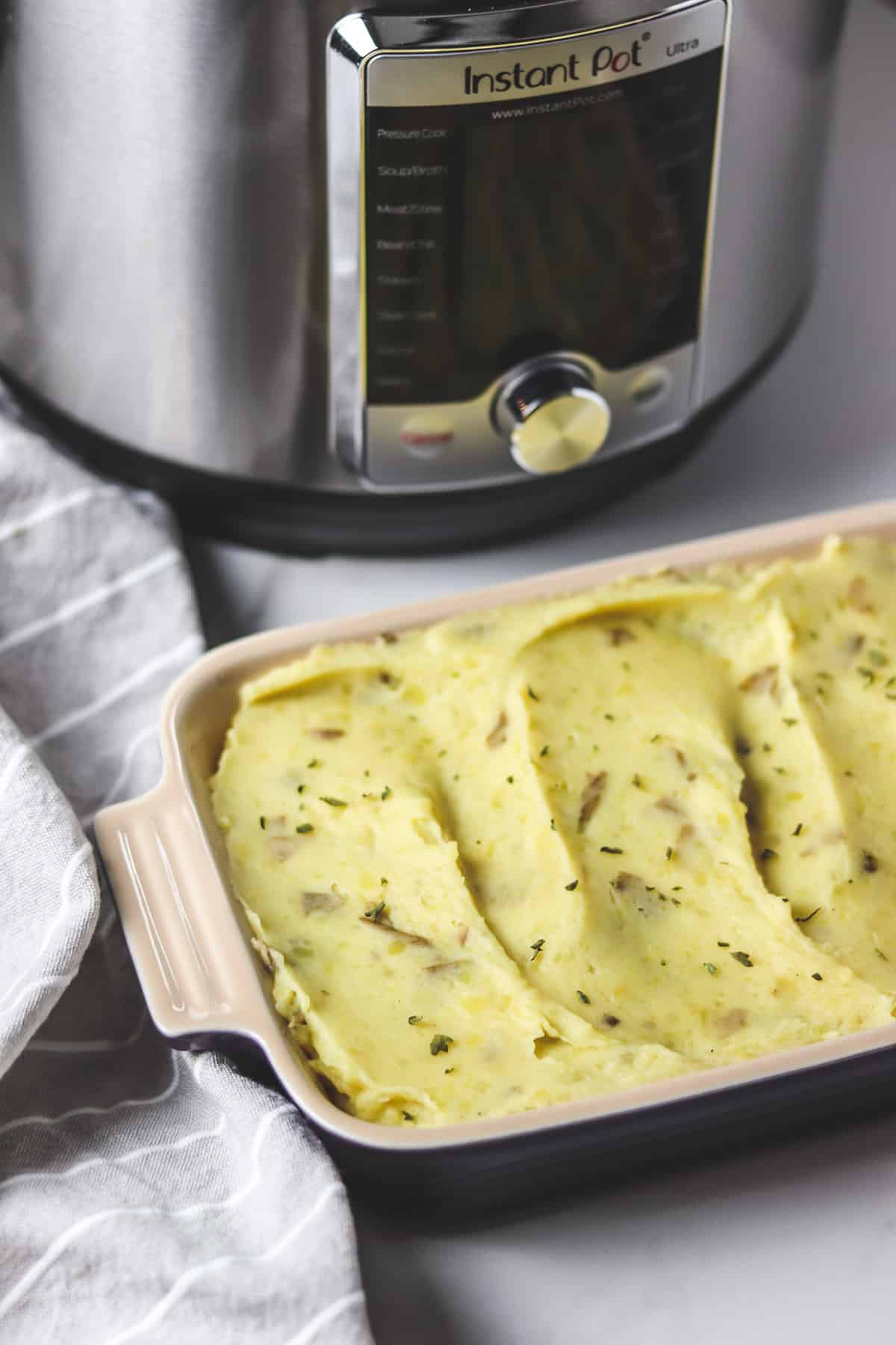 pan of mashed potatoes in front of an instant pot