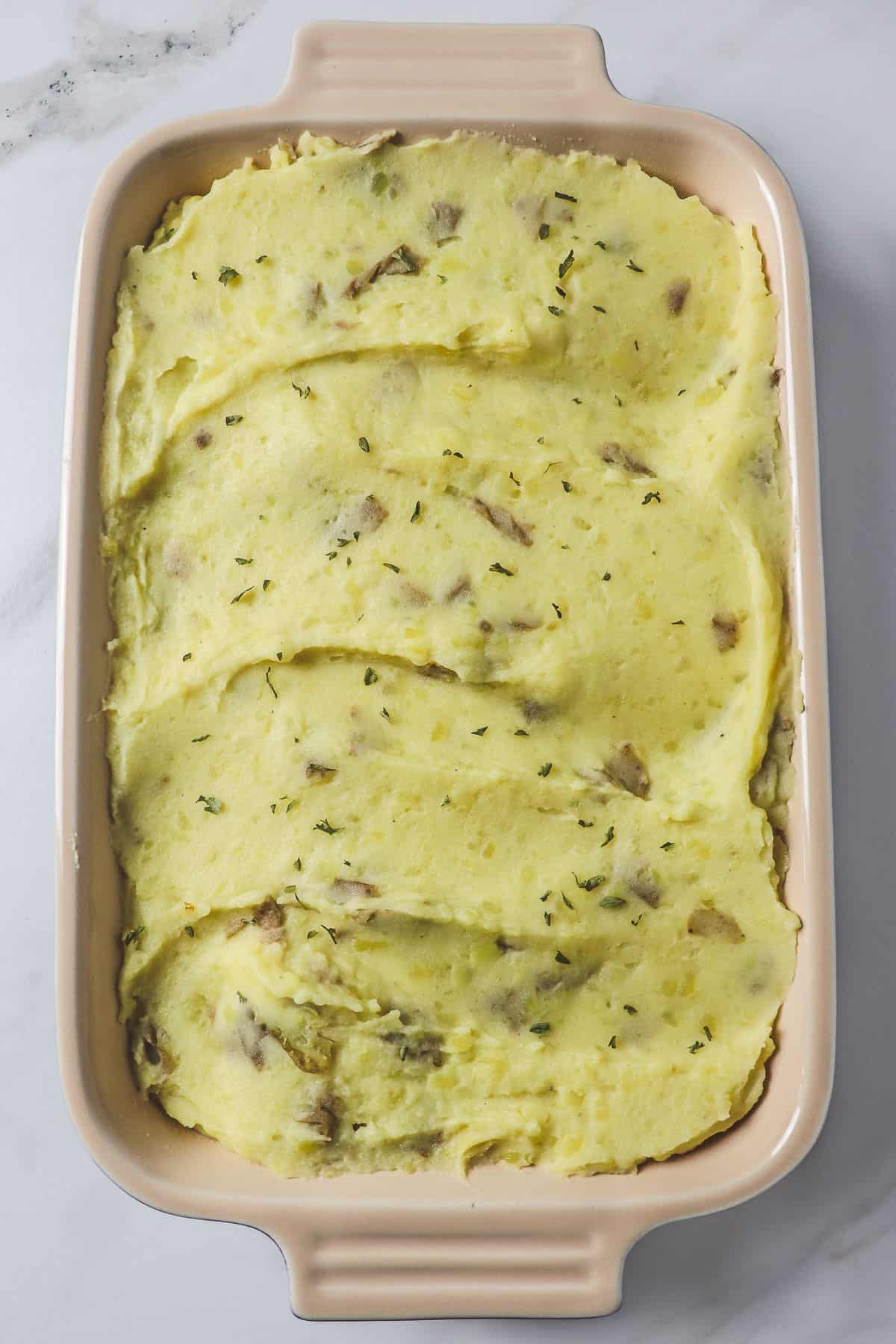 casserole dish filled with instant pot mashed potatoes