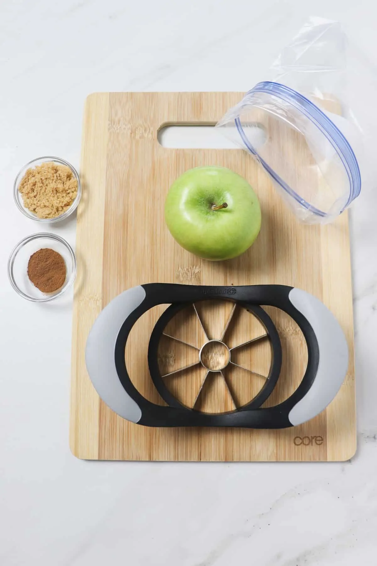 ingredients and tools for making cinnamon sugar apple slices