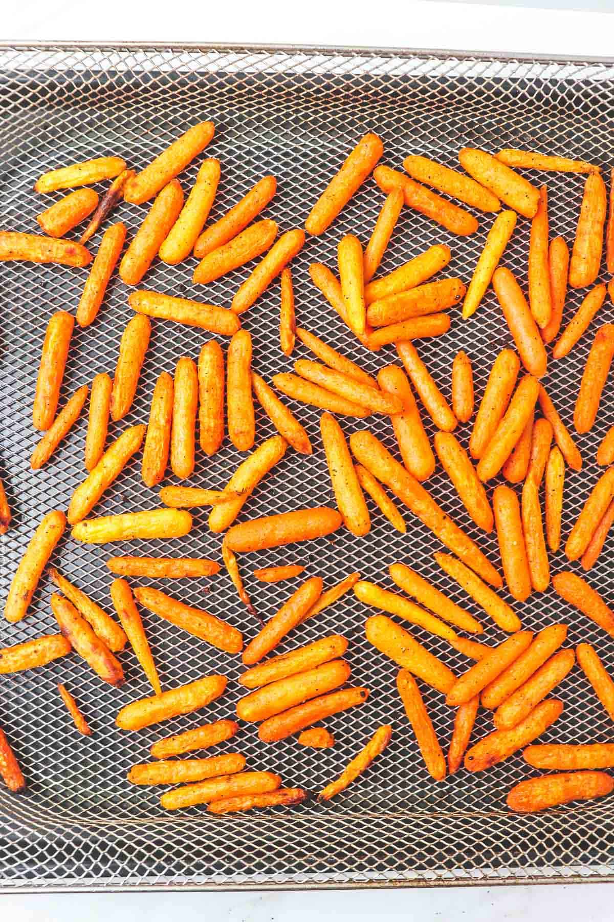 finished roasted carrots in air fryer basket