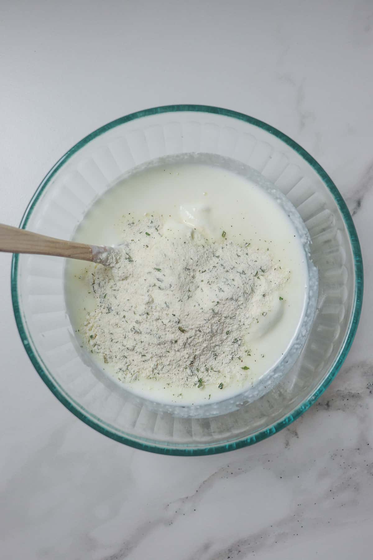 ingredients for ranch in glass bowl before mixing