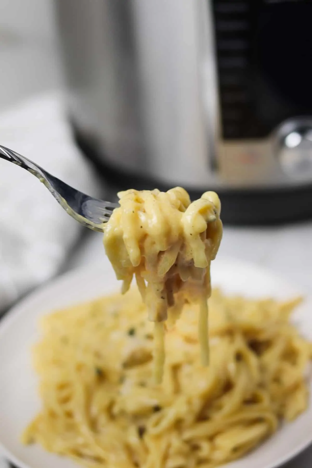 fork full of instant pot chicken spaghetti