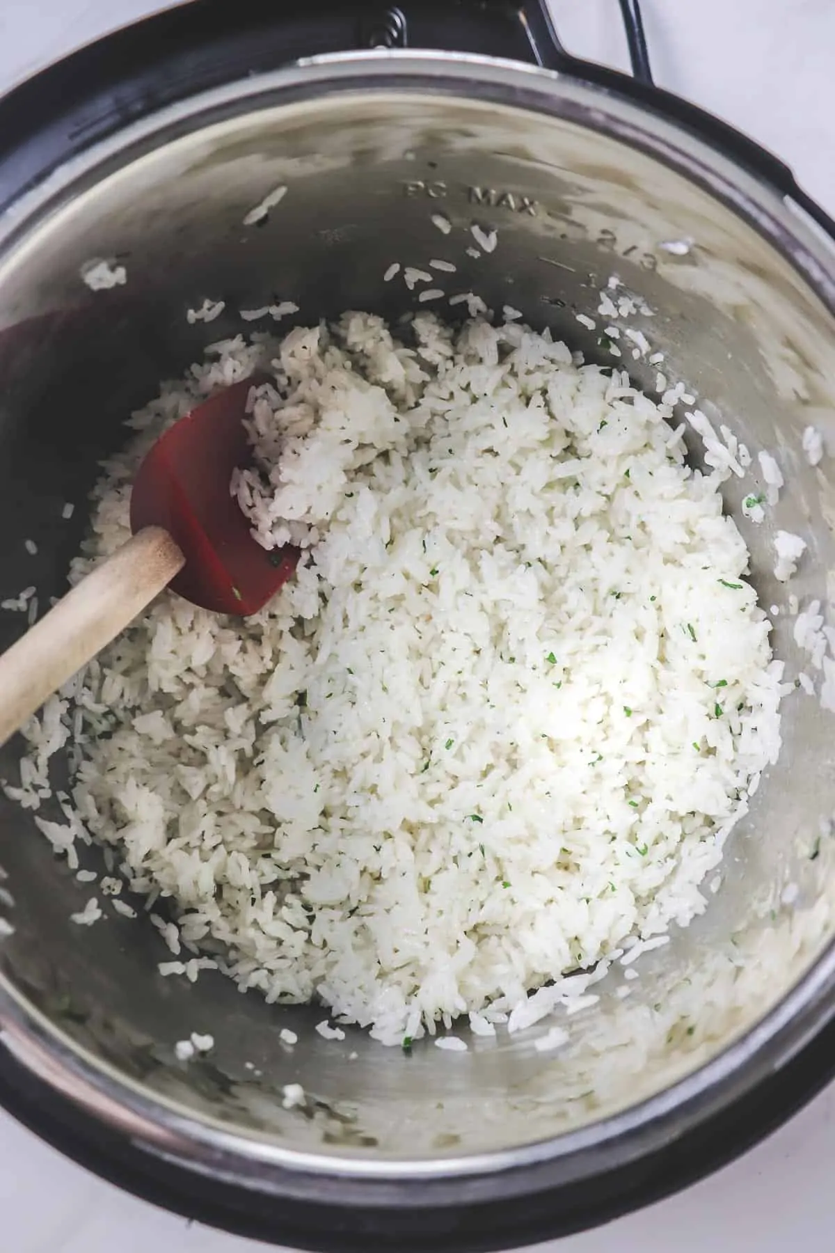 instant pot cilantro lime rice with red spoon
