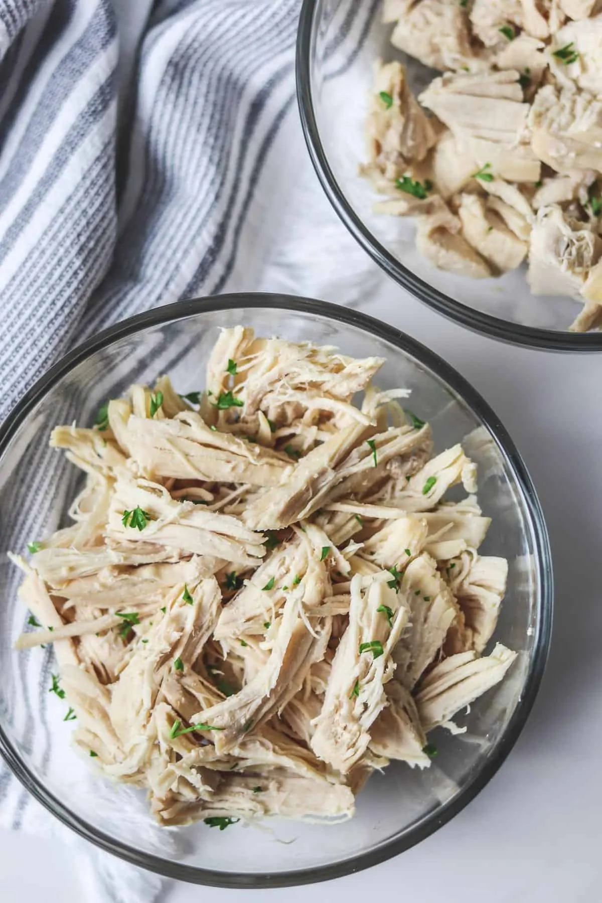 bowls of shredded and diced chicken tenderloin