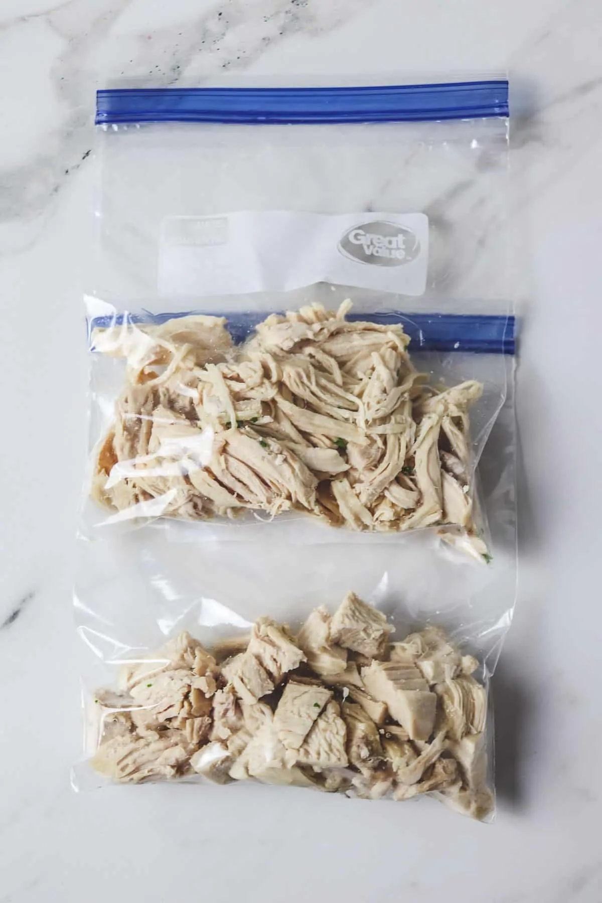 shredded and diced chicken in plastic bags ready to freeze