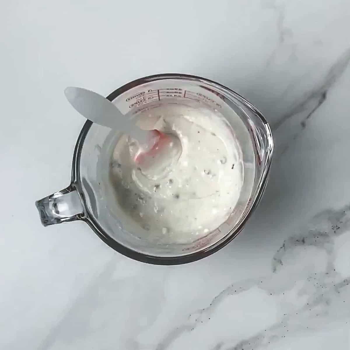 muffin batter in a measuring cup