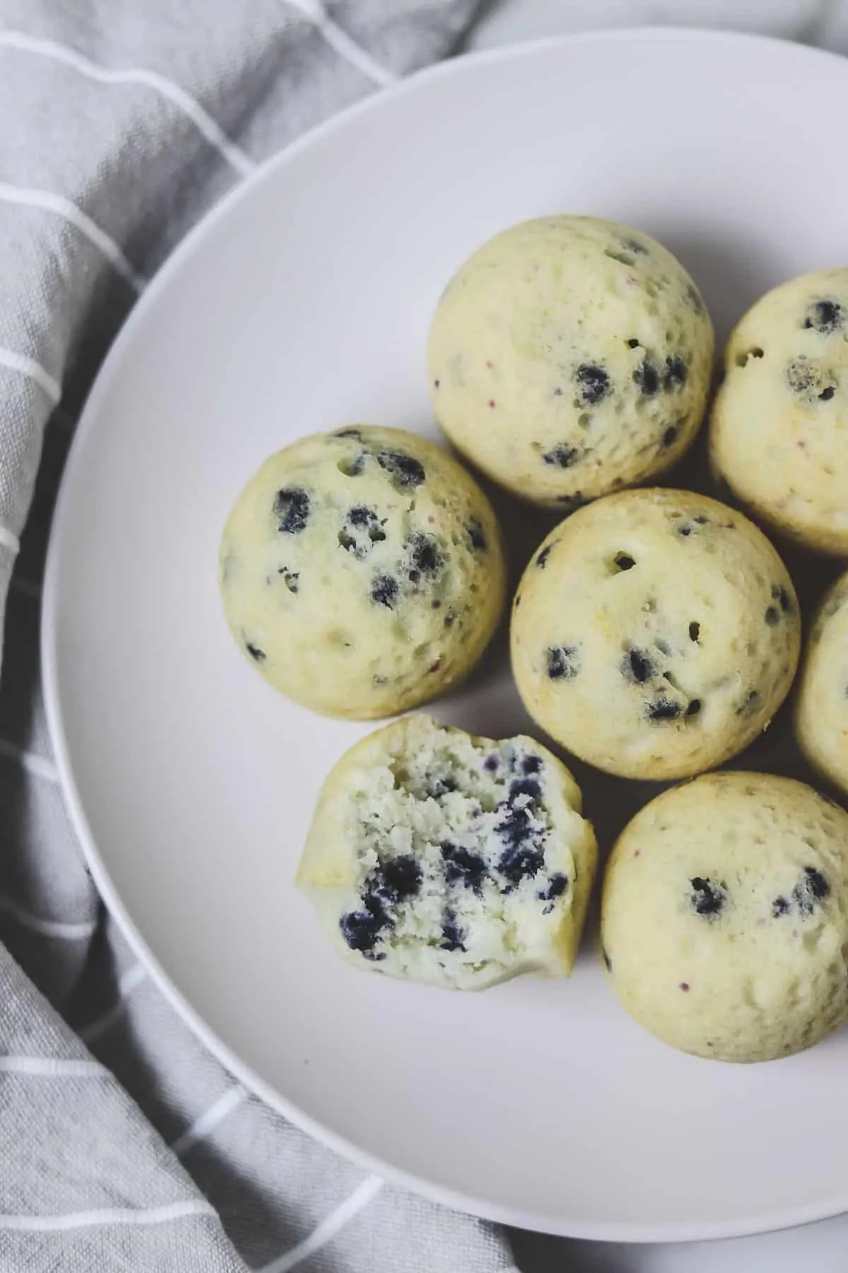 instant pot muffin bites on a white plate with grey napkin