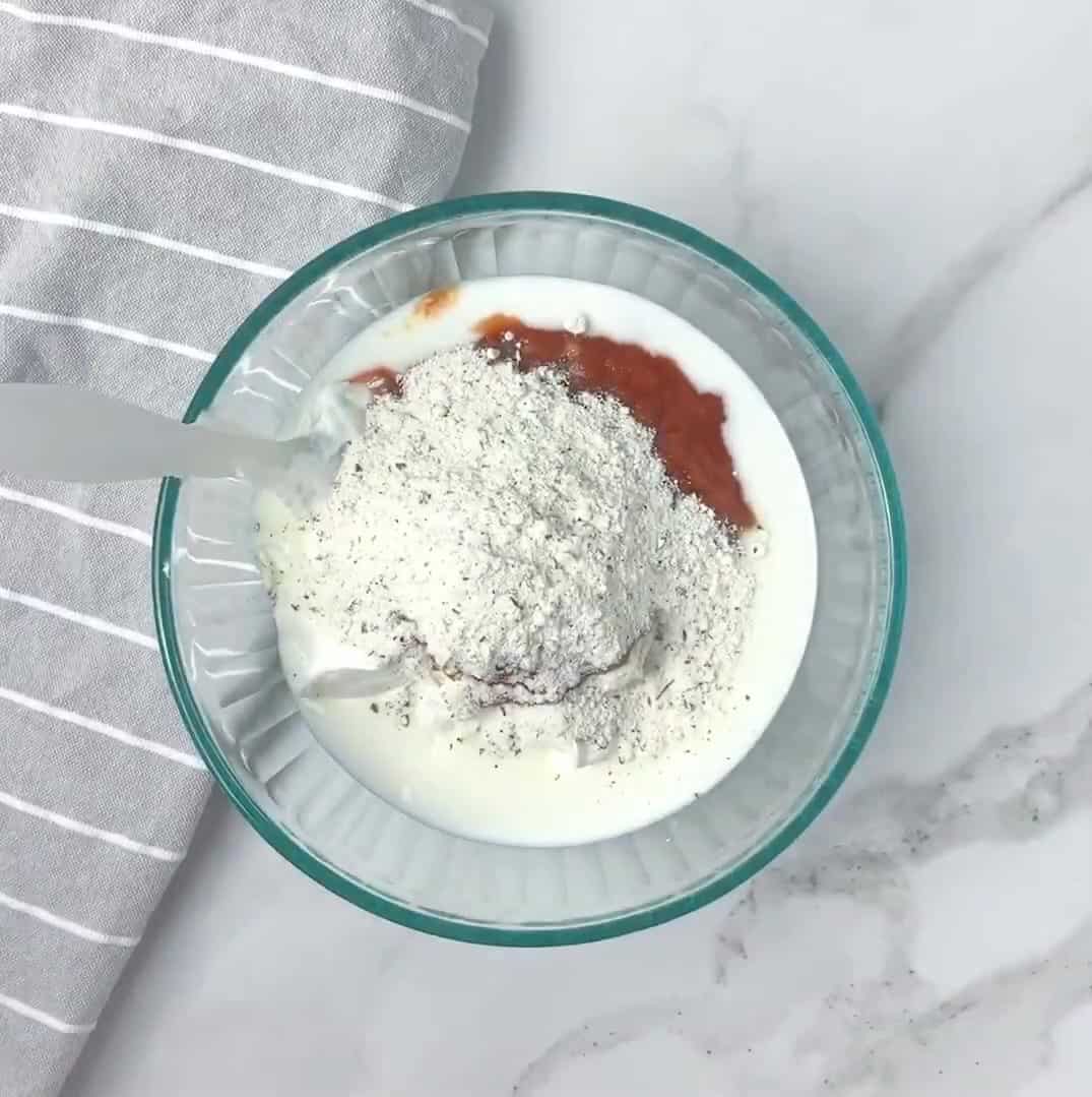 ingredients for salsa ranch dumped in a glass mixing bowl