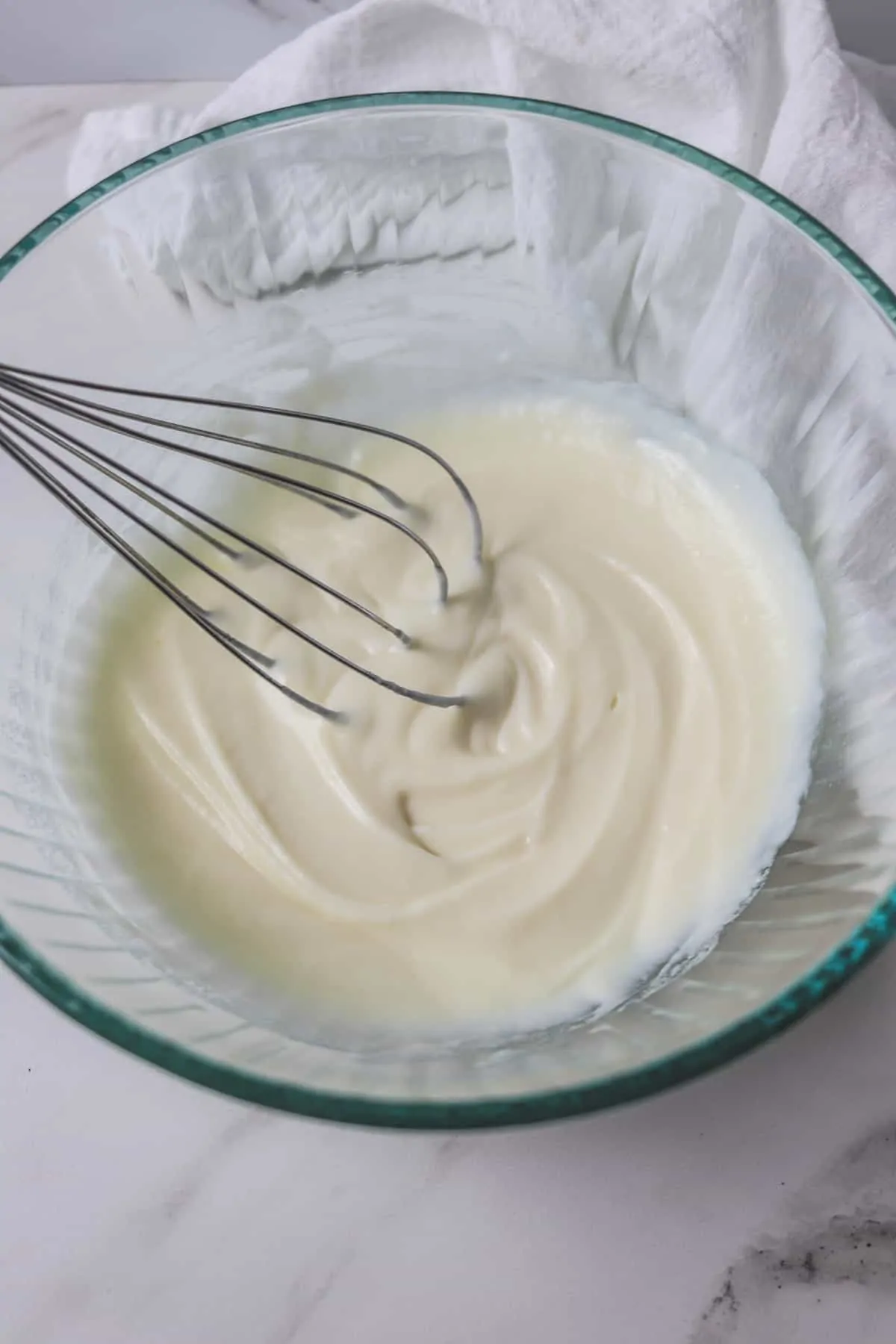 milk and pudding whisked in mixing bowl