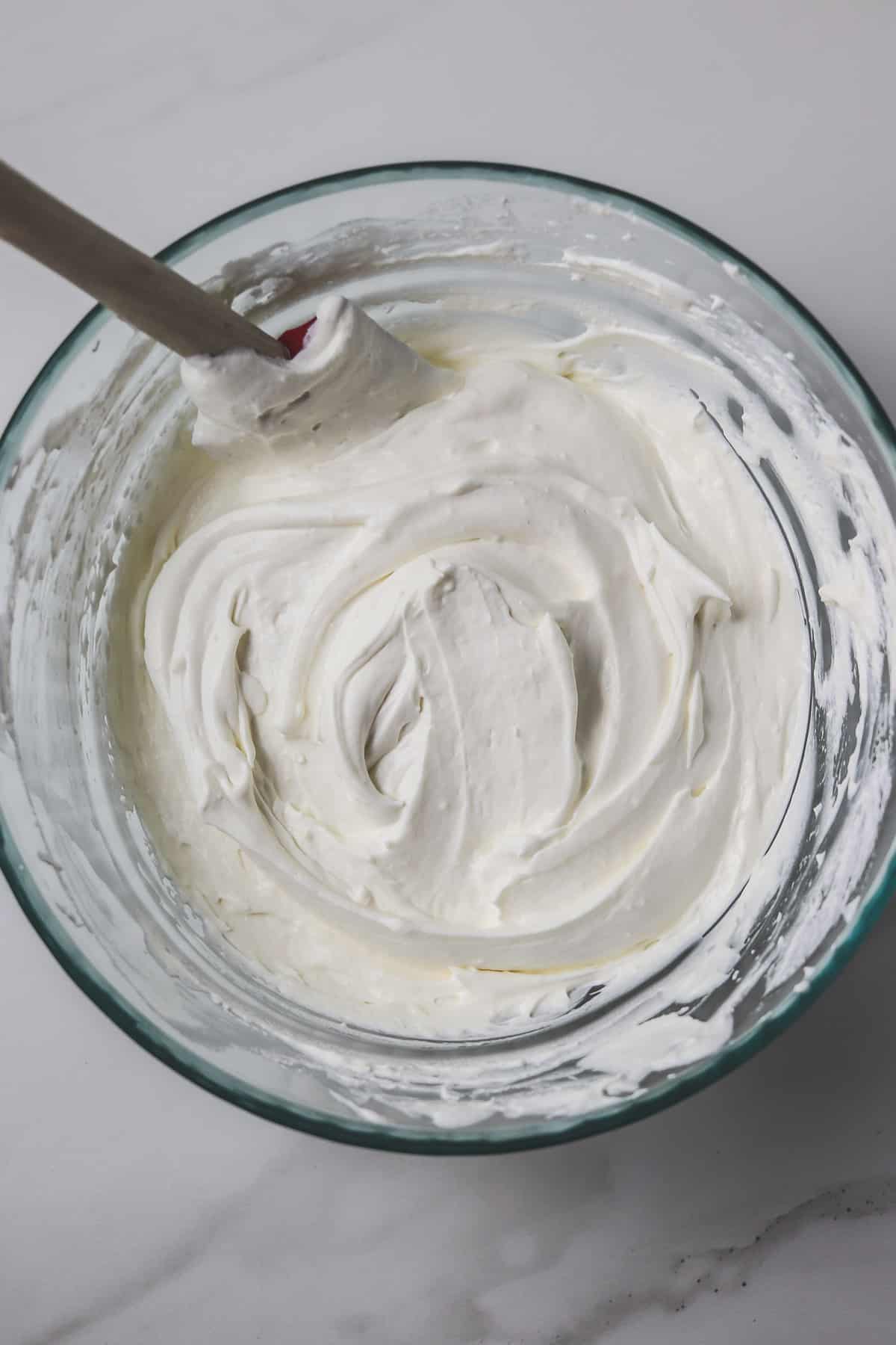 chilled sugar-free frosting in glass mixing bowl