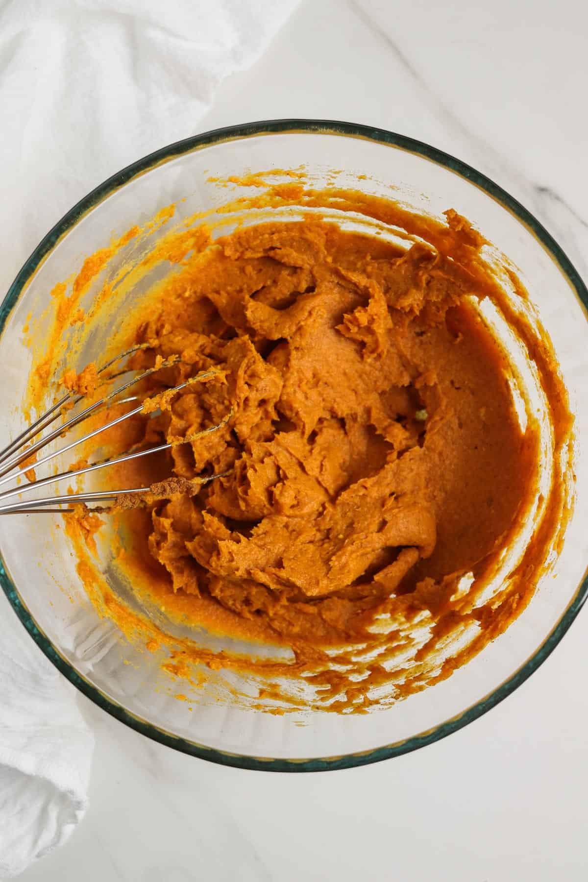 whisking pumpkin puree with pudding mix