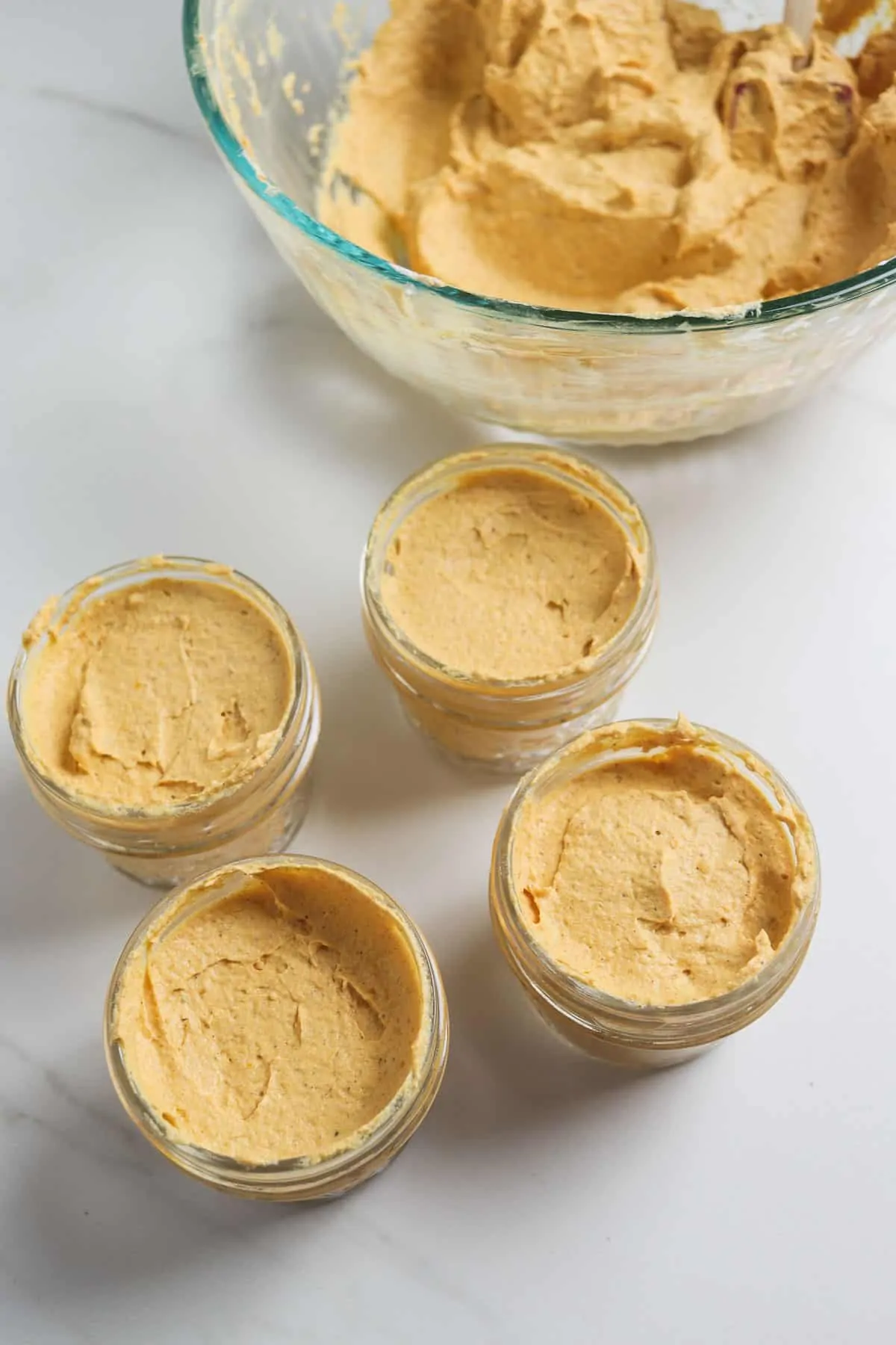 filling mason jars with pumpkin fluff