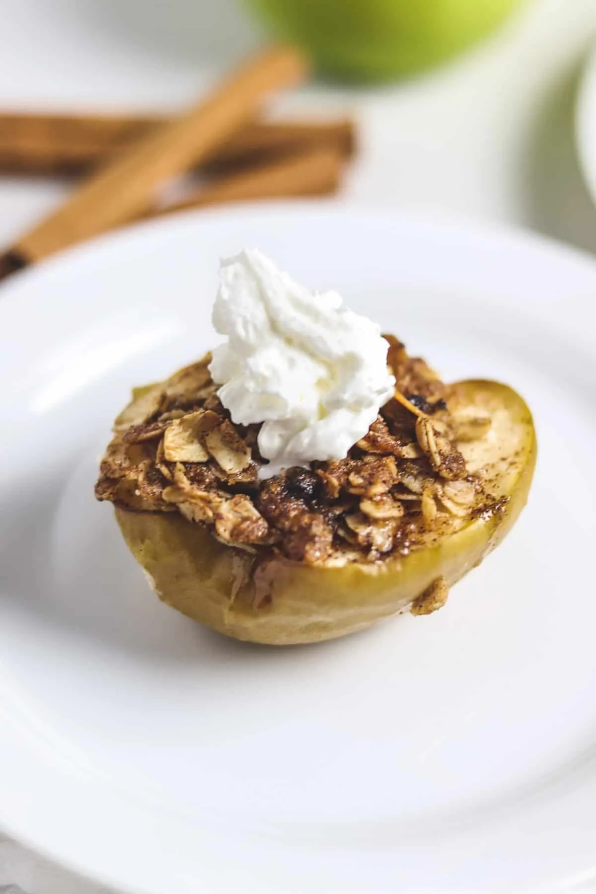 finished air fryer baked apple topped with whipped cream