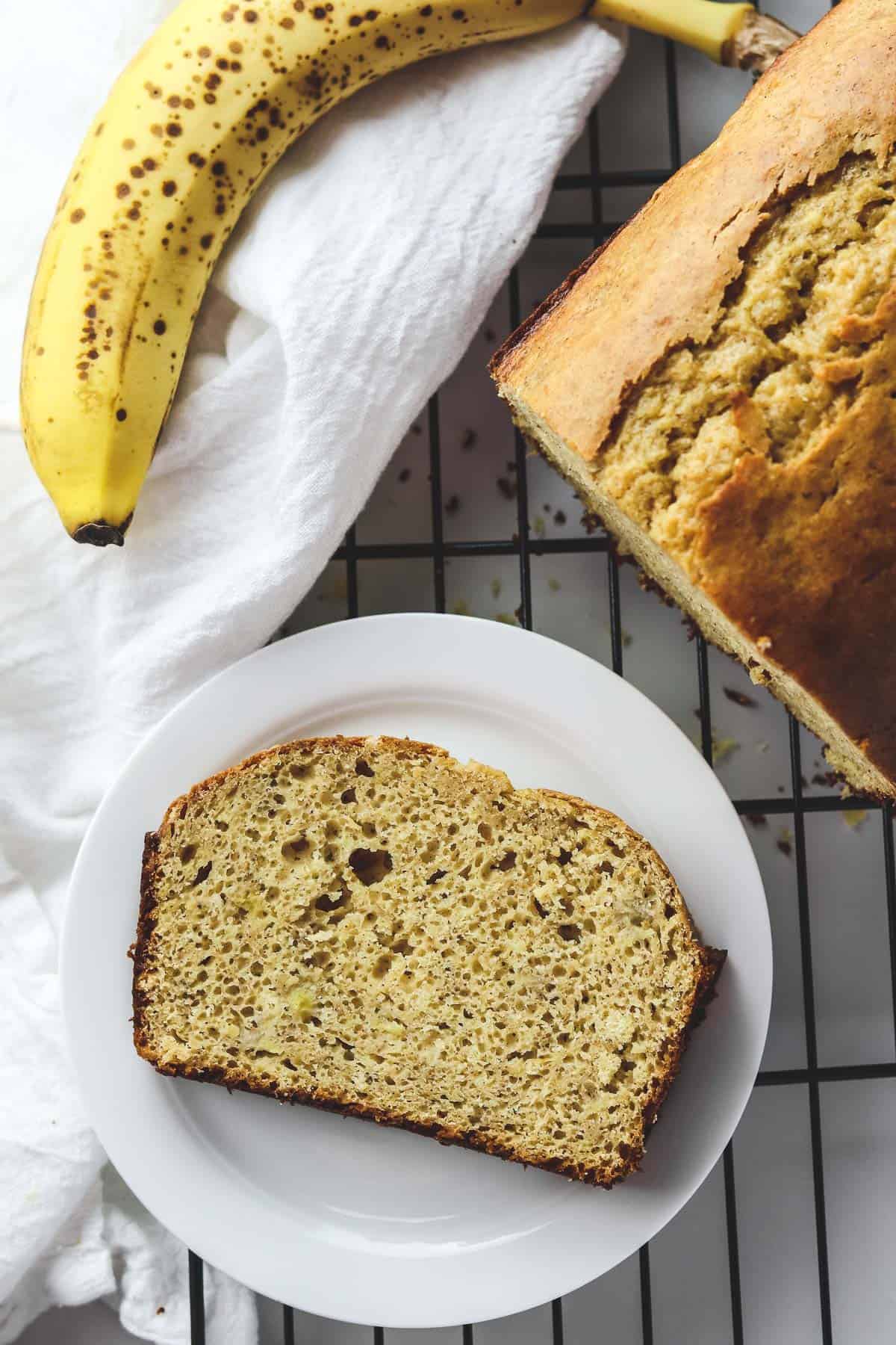 a piece of banana bread on a white plate