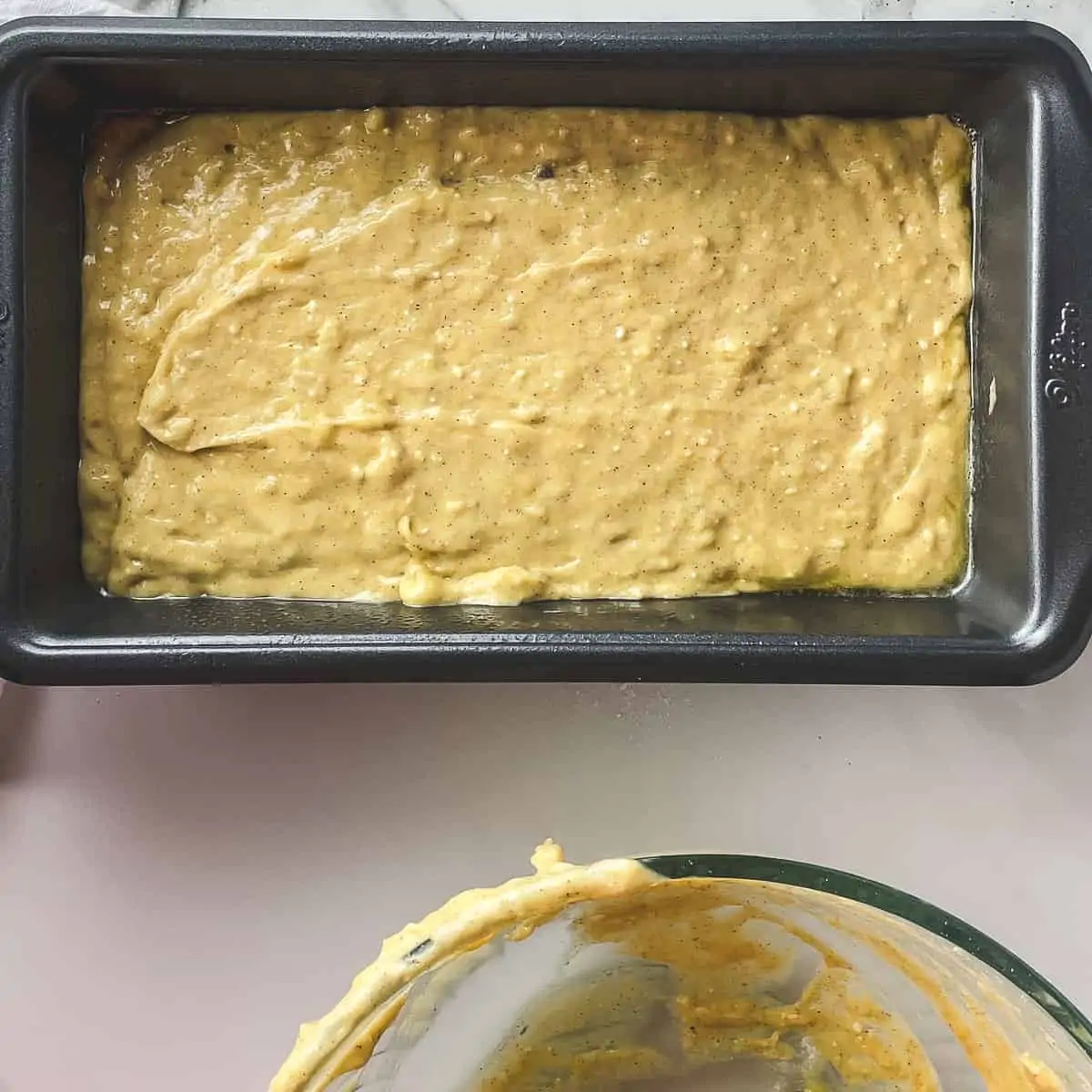 banana bread batter in loaf pan