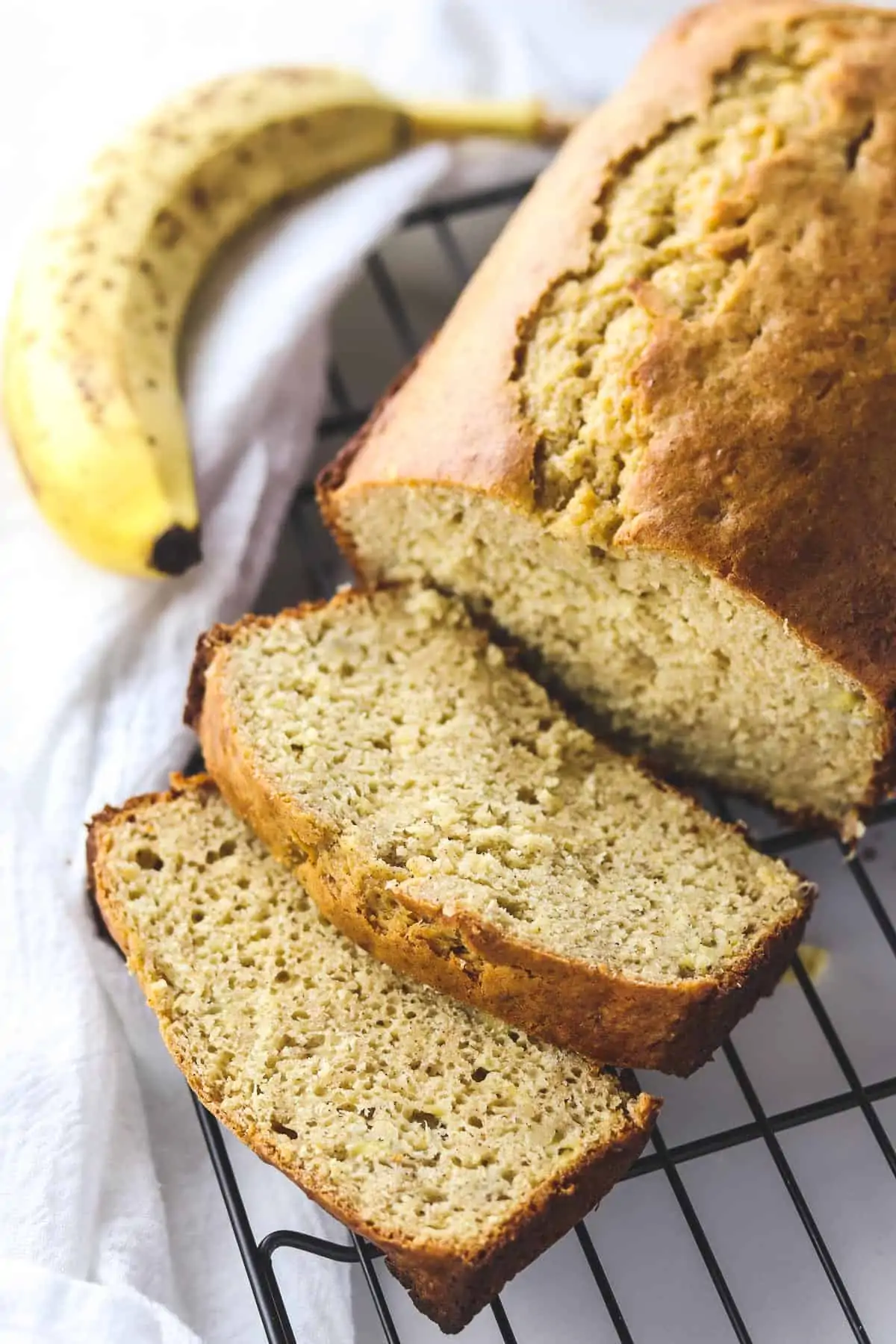 low calorie banana bread sliced on a cooling rack
