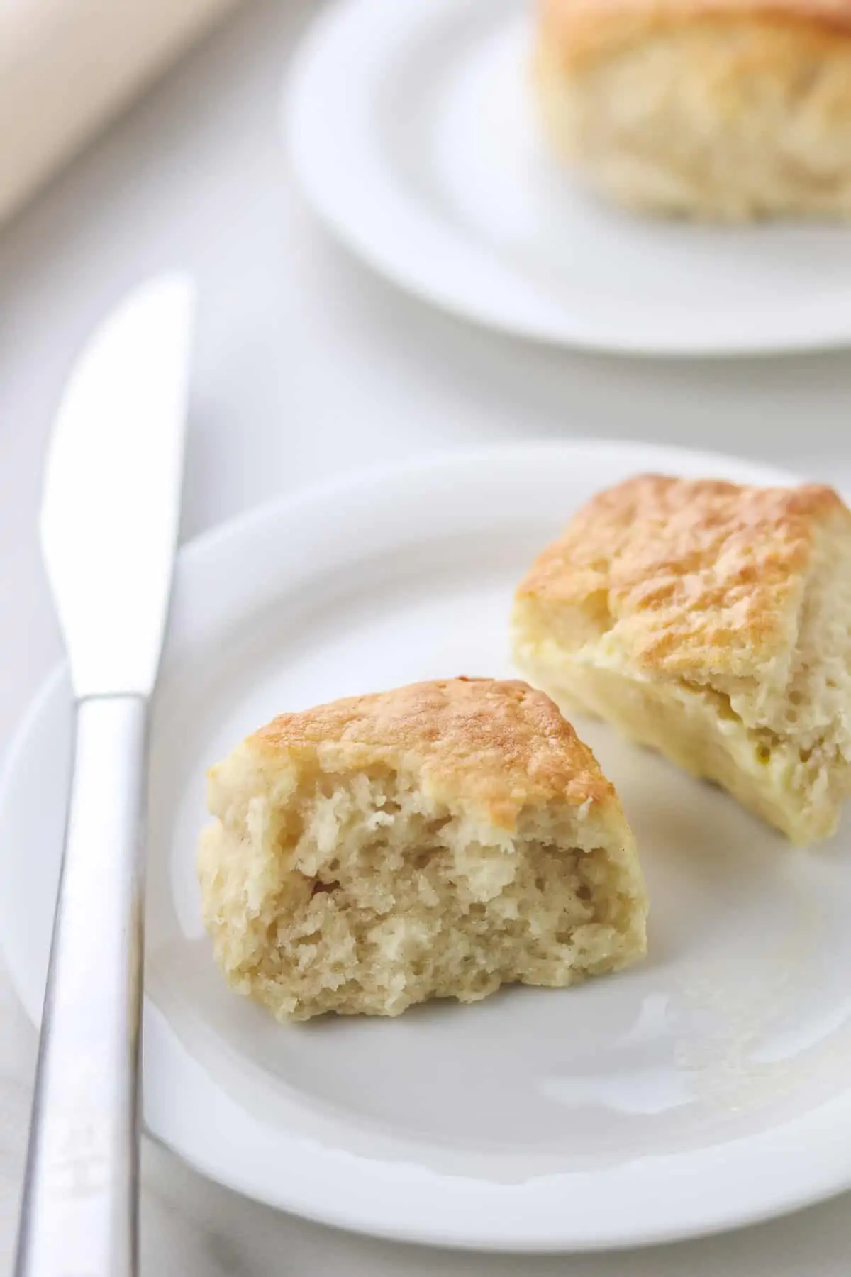 low calorie biscuit cut in half on a white plate