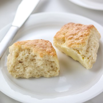 biscuit cut in half on a white plate