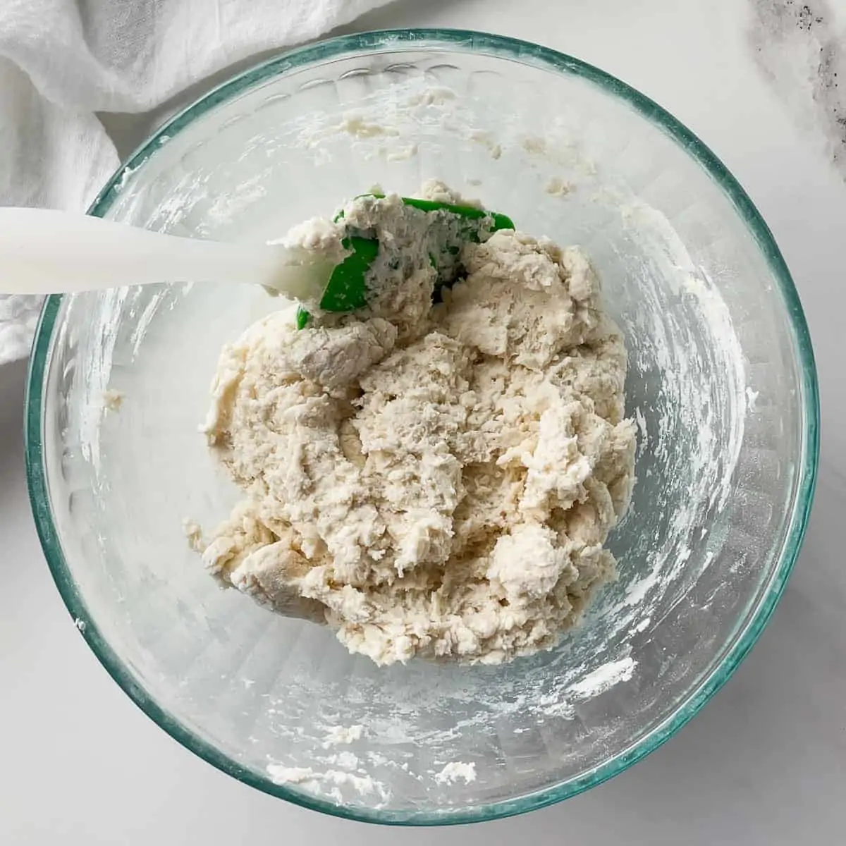 mixed biscuit dough in mixing bowl