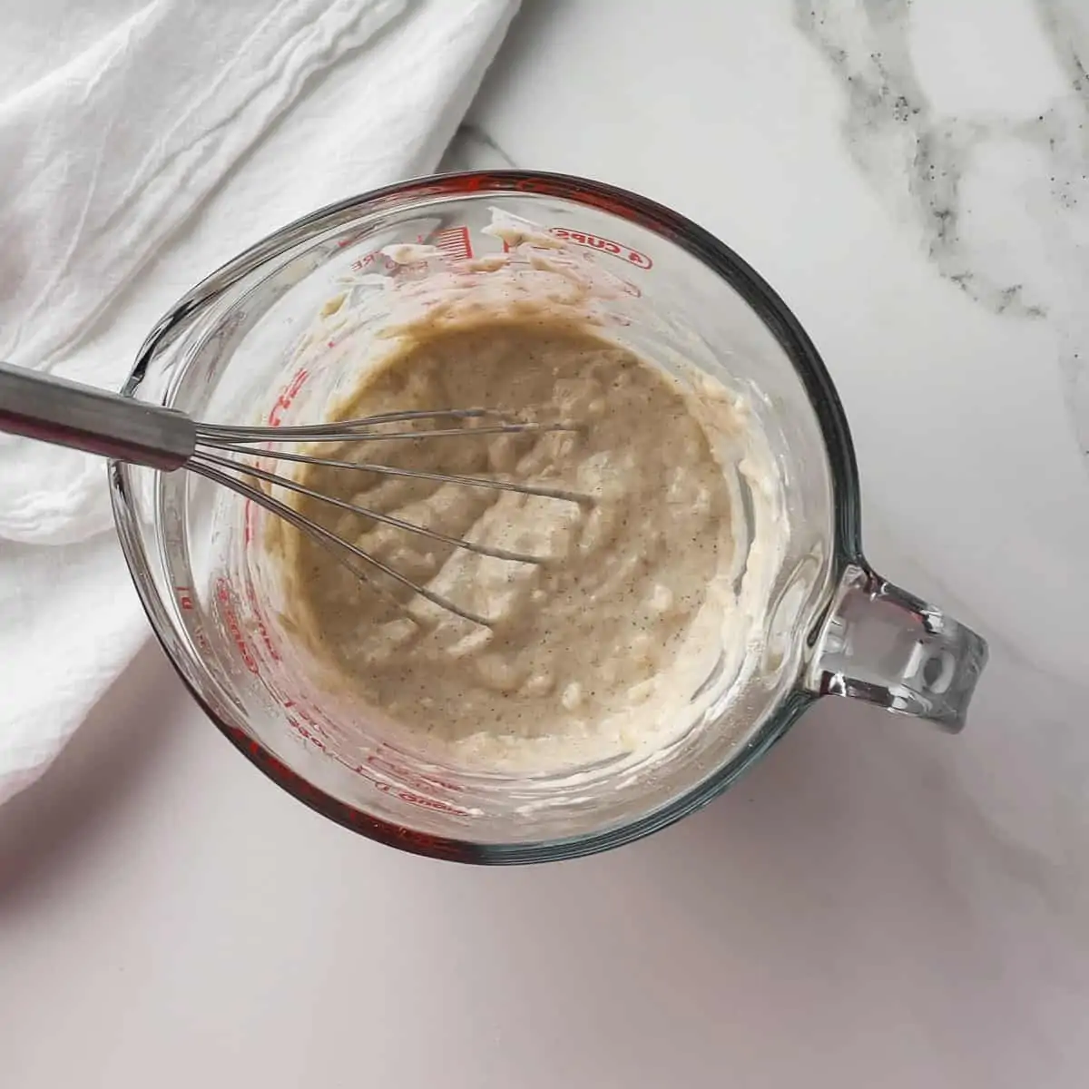 low calorie pancake batter in a mixing cup