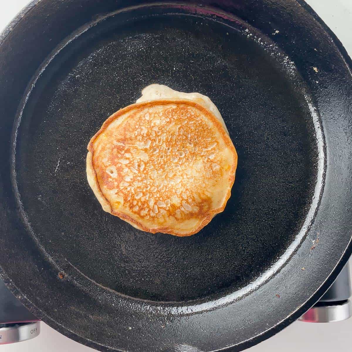 cooked pancake in cast iron skillet