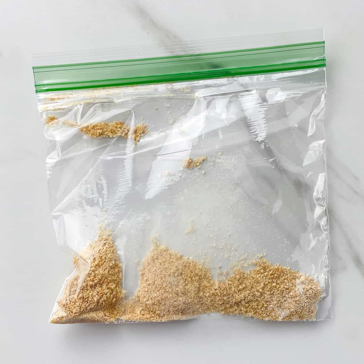 crushed graham cracker in a plastic bag