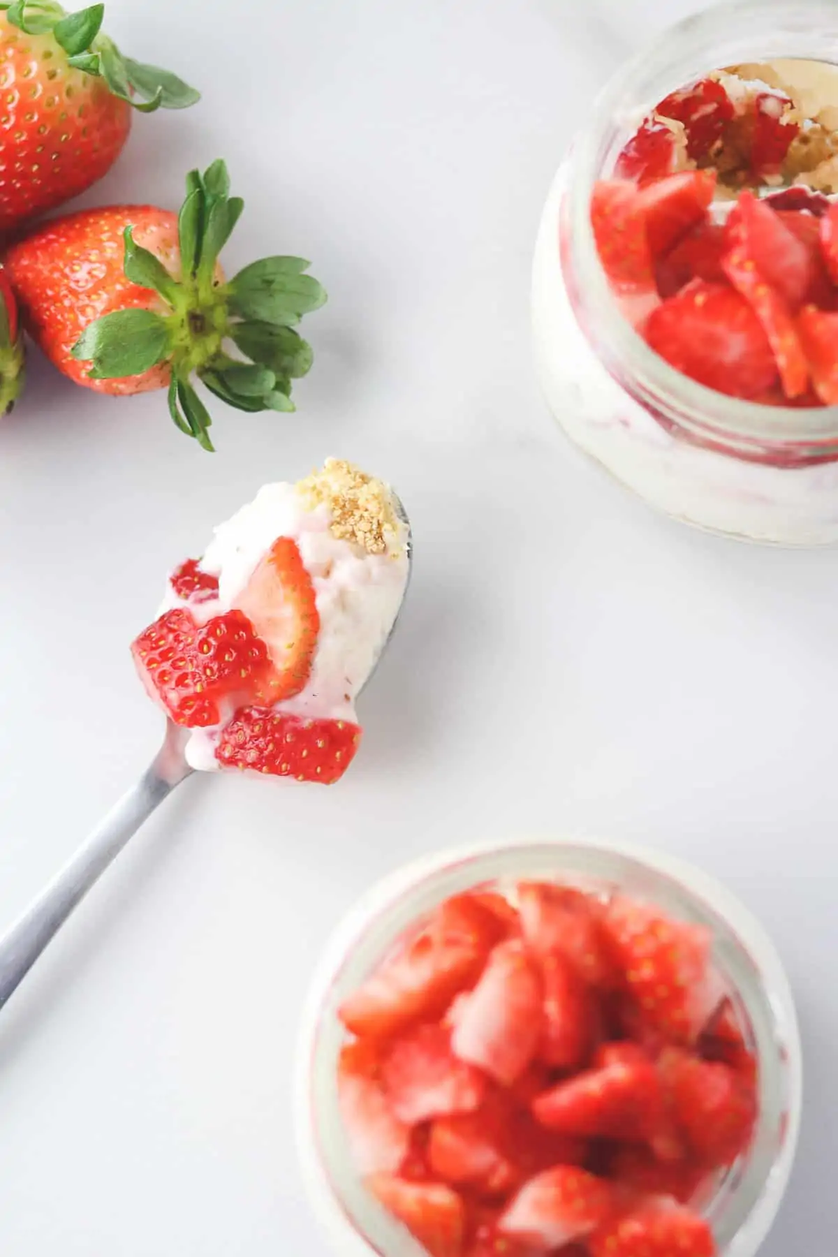 top down view of strawberry cheesecake jars