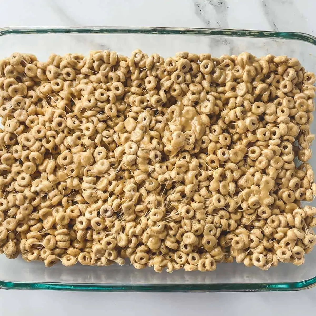 finished cheerio bars in pan before slicing