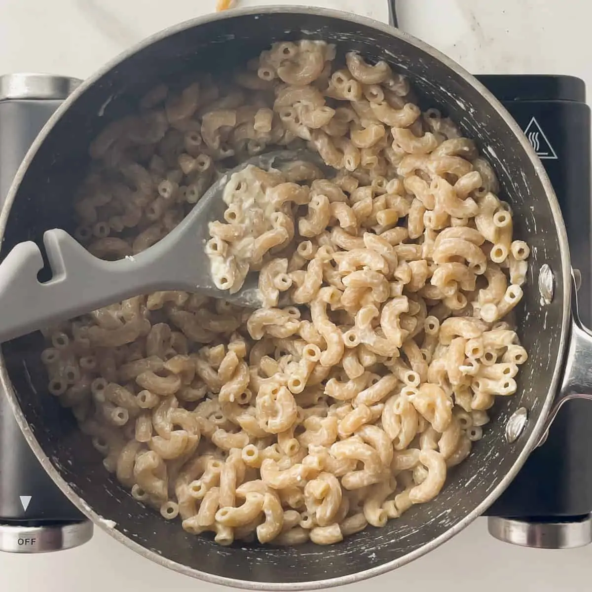 laughing cow melted into whole wheat elbow noodles